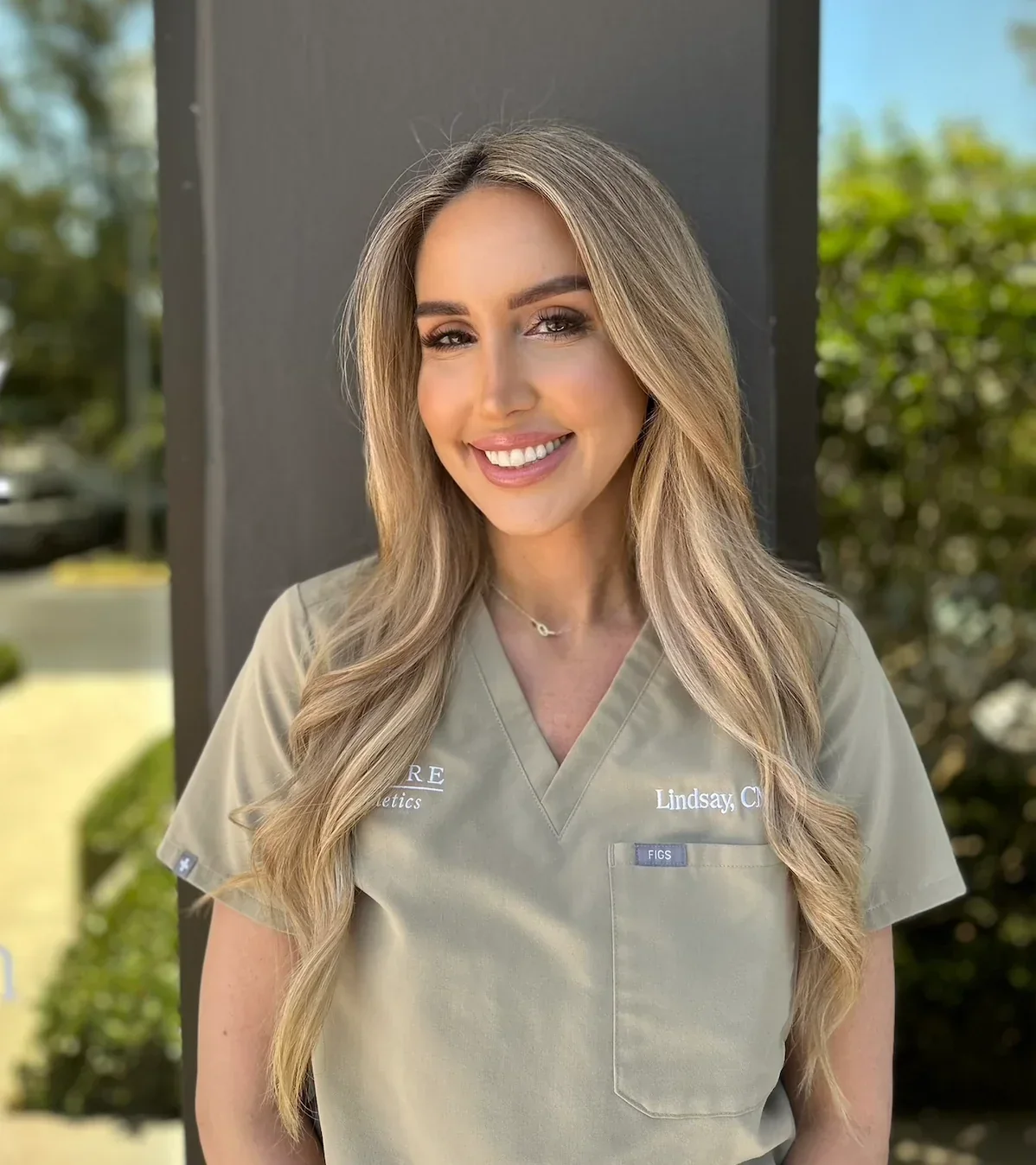 Allure Aesthetics clinician in branded clinical attire
