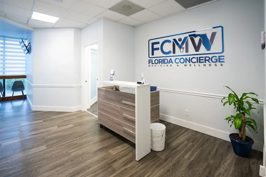 Empty reception desk with Florida Concierge Medicine and Wellness lettering on the wall.