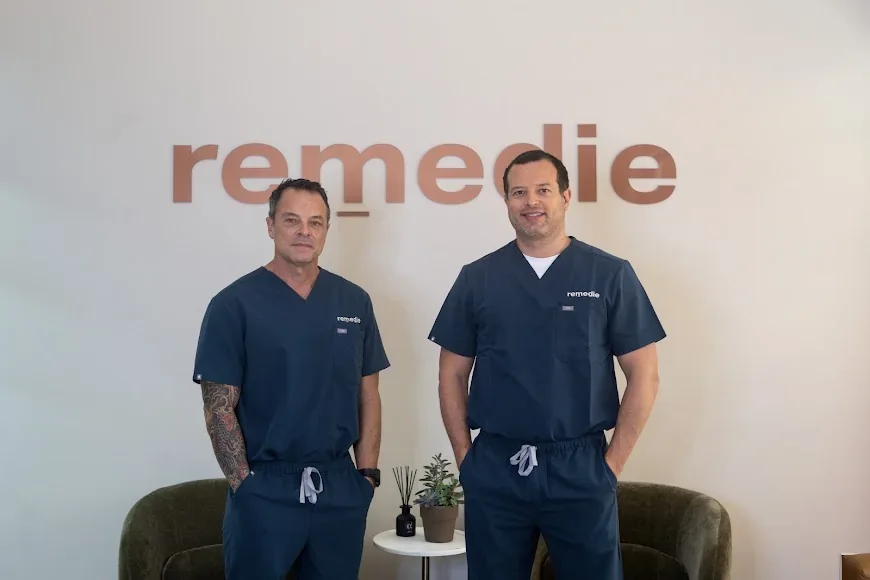 remedie team members pictured beneath the clinic lettering.
