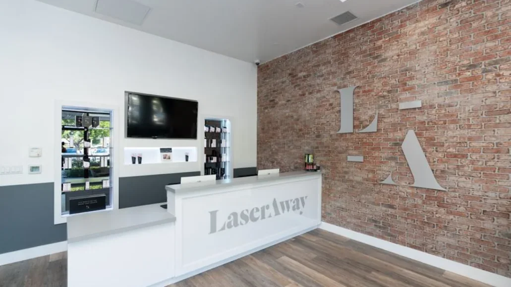 LaserAway Fort Lauderdale branded reception counter.