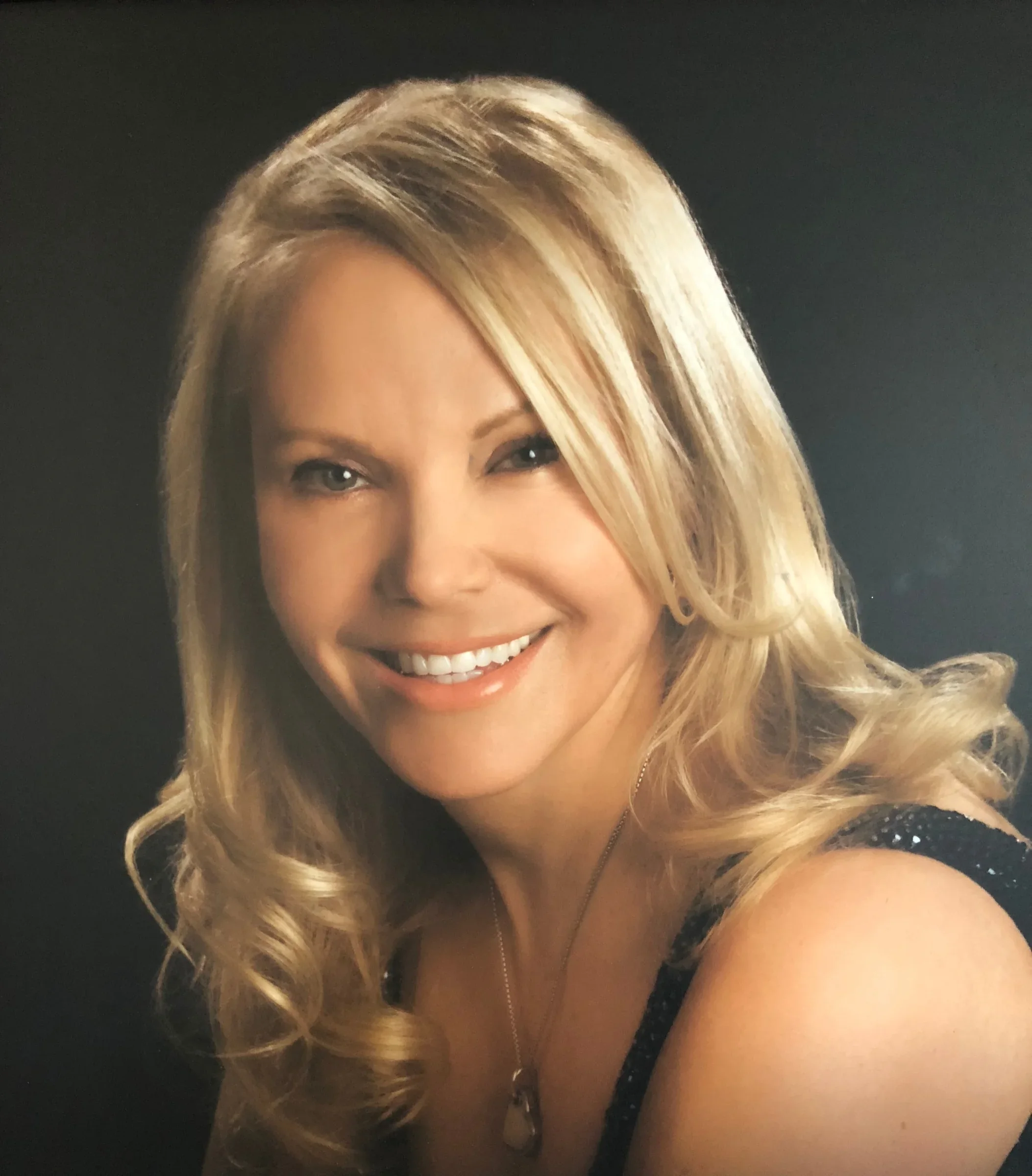 Posed portrait of Michelle Hoff, as identified by Timeless Beauty's website.