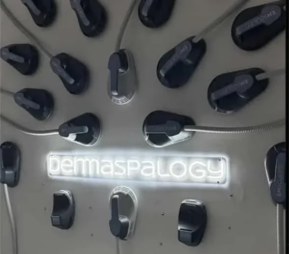DermaSpalogy wall lettering surrounded by device applicators.