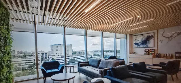 A window-lined lounge shown in Universal Medical & Wellness Center's branch gallery.