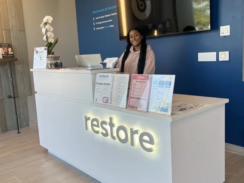Restore Pembroke Pines reception counter and blue accent wall.
