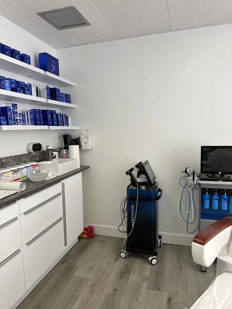 White cabinets, product shelves and equipment in an unoccupied Toxwell room.