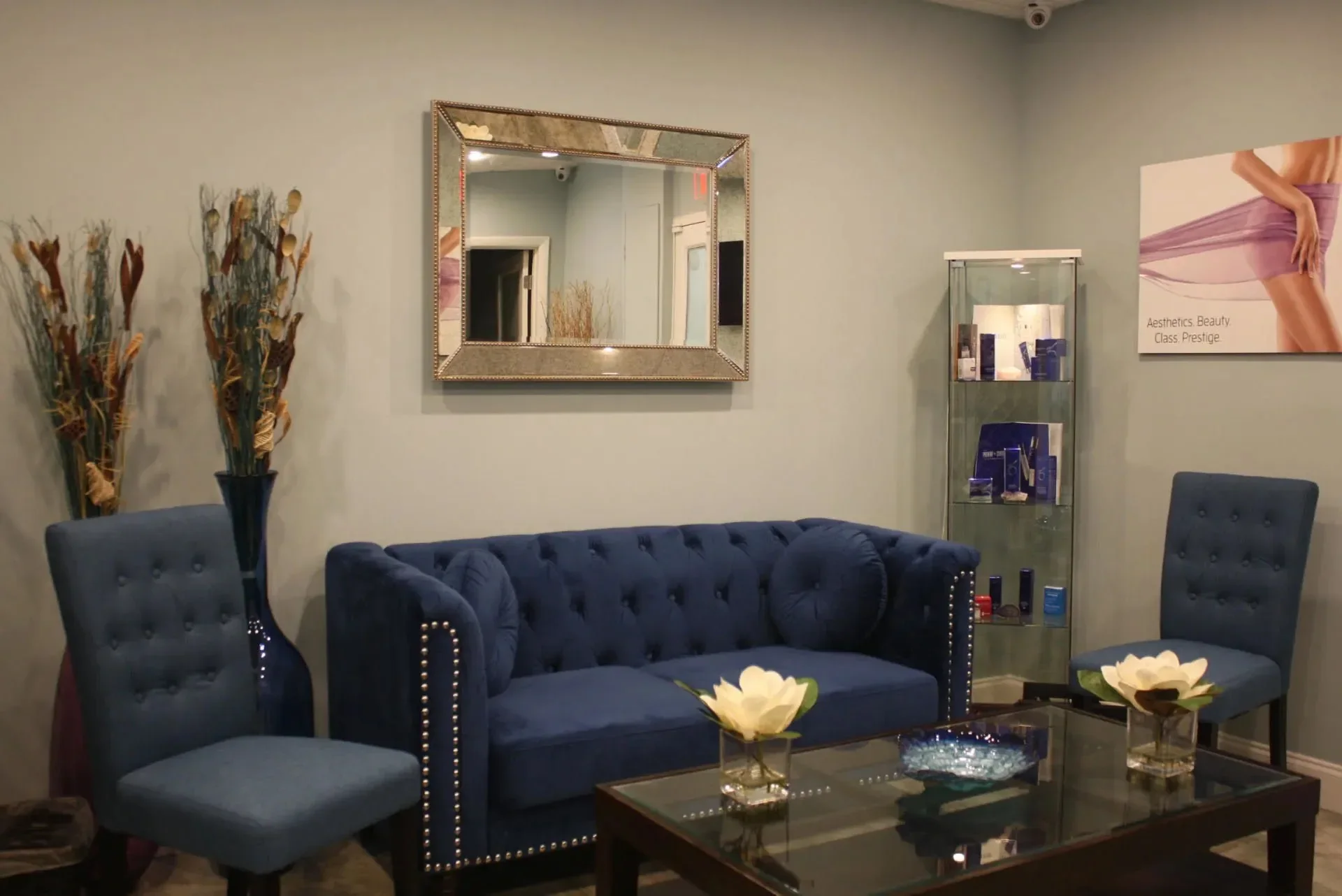 Navy waiting-room seating and decor inside Prestige in Boca Raton.