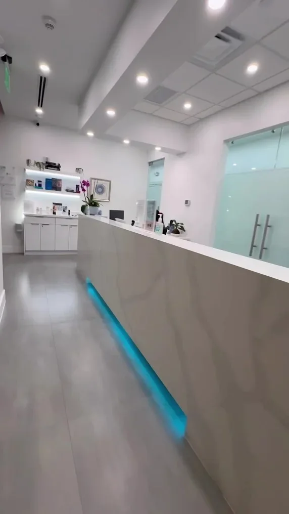 Complete Dermatology reception with a lighted front desk.